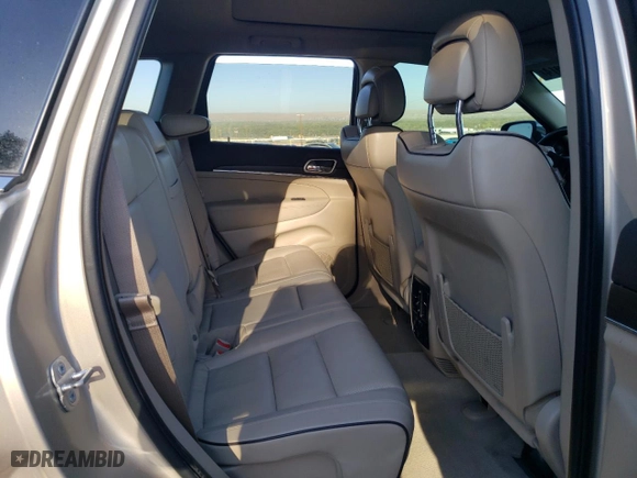 2014 Jeep Grand Cherokee Overland with VIN 1C4RJFCM2EC556953, listed as a Copart auction lot 73046974 with 106,889 mi miles and Salvage Title. Bid and sale history available at carsss.com. Image 10.