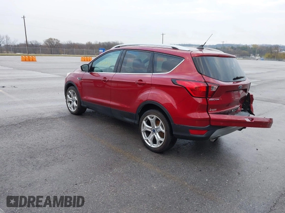 2019 Ford Escape Titanium z VIN 1FMCU9J99KUA18880, wystawiony jako IAAI lot #40830436 z przebiegiem 117 499 mil mil oraz . Historia ofert i sprzedaży dostępna na DreamBid. Obrazek 3.