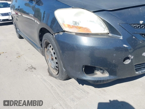 2007 Toyota Yaris with VIN JTDBT923371105048, listed as a IAAI auction lot 41759923 with 166,458 mi miles. Bid and sale history available at carsss.com. Image 12.