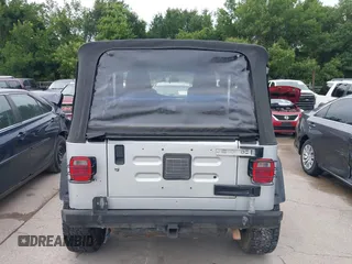 2005 Jeep Wrangler X z VIN 1J4FA39S95P370868, wystawiony jako IAAI lot #42476186 z przebiegiem 144 986 mil mil oraz . Historia ofert i sprzedaży dostępna na DreamBid. Obrazek 16.