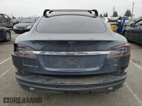 2014 Tesla Model S 60 with VIN 5YJSA1S14EFP56277, listed as a Copart auction lot 57162685 with Not provided miles and Salvage title. Bid and sale history available at DreamBid. Image 6.
