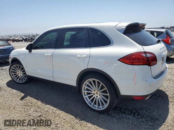 2014 Porsche Cayenne with VIN WP1AA2A28ELA09742, listed as a Copart auction lot 61779285 with 182,380 mi miles and Salvage title. Bid and sale history available at DreamBid. Image 2.