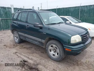 2003 Suzuki Vitara JLX z VIN 2S3TD52V036101351, wystawiony jako IAAI lot #42470824 z przebiegiem 198 650 mil mil oraz . Historia ofert i sprzedaży dostępna na DreamBid. Obrazek 1.