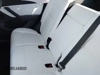 2021 Tesla Model Y Long Range with VIN 5YJYGDEE5MF203175, listed as a IAAI auction lot 41758334 with 63,387 mi miles and . Bid and sale history available at DreamBid. Image 8.