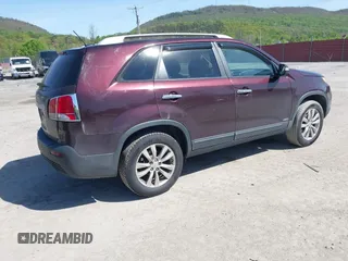 2012 Kia Sorento LX with VIN 5XYKTCA64CG279195, listed as a IAAI auction lot 42144679 with 116,690 mi miles. Bid and sale history available at carsss.com. Image 4.