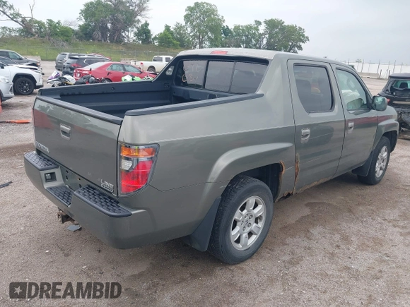 2007 Honda Ridgeline RTL with VIN 2HJYK16517H513832, listed as a IAAI auction lot 42626411 with 209,171 mi miles and . Bid and sale history available at DreamBid. Image 4.