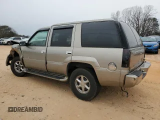 2000 Cadillac Escalade z VIN 1GYEK63R9YR218680, wystawiony jako Copart lot #87393204 z przebiegiem 295 494 mil mil oraz Szkoda całkowita • Salvage title. Historia ofert i sprzedaży dostępna na DreamBid. Obrazek 2.
