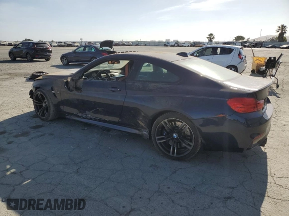 2015 BMW M4 with VIN WBS3R9C50FK335084, listed as a Copart auction lot 61962965 with 142,157 mi miles and Salvage title. Bid and sale history available at DreamBid. Image 2.