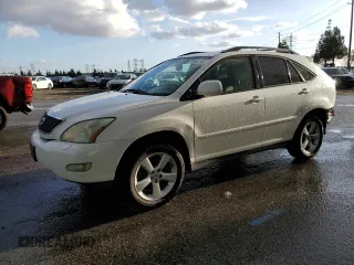 2006 Lexus RX 330 with VIN JTJGA31UX60060839, listed as a Copart auction lot 79948144 with 168,640 mi miles and Salvage Title. Bid and sale history available at DreamBid. Image 1.