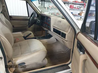 1996 Jeep Cherokee Country with VIN 1J4FT78S5TL232090, listed as a IAAI auction lot 42267272 with 255,417 mi miles and . Bid and sale history available at DreamBid. Image 5.