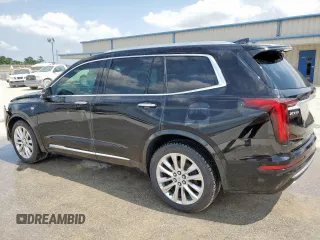 2020 Cadillac XT6 FWD Premium Luxury z VIN 1GYKPCRSXLZ104502, wystawiony jako Copart lot #58211275 z przebiegiem 97 053 mil mil oraz Szkody całkowita. Historia ofert i sprzedaży dostępna na DreamBid. Obrazek 2.