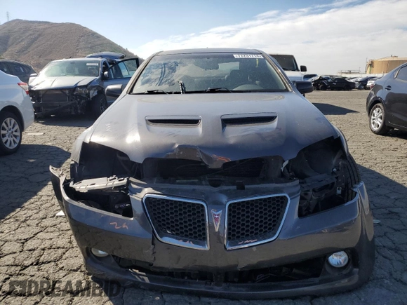 2009 Pontiac G8 GT with VIN 6G2EC57Y19L215718, listed as a Copart auction lot 77231714 with 57,515 mi miles and Salvage Title. Bid and sale history available at carsss.com. Image 5.