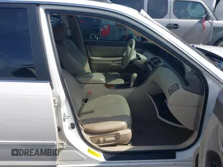 2001 Toyota Avalon XL z VIN 4T1BF28B71U166532, wystawiony jako IAAI lot #42149996 z przebiegiem 172 698 mil mil oraz . Historia ofert i sprzedaży dostępna na DreamBid. Obrazek 5.