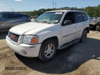 2003 GMC Envoy SLT with VIN 1GKDS13SX32153772, listed as a Copart auction lot 52449815 with 292,752 mi miles and Salvage Title. Bid and sale history available at carsss.com. Image 1.