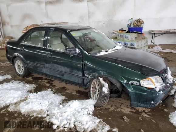 1999 Mazda Protege DX z VIN JM1BJ2220X0108600, wystawiony jako Copart lot #77004894 z przebiegiem 220 836 mil mil oraz Szkoda całkowita • Salvage title. Historia ofert i sprzedaży dostępna na DreamBid. Obrazek 4.