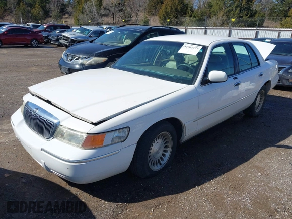 2002 Mercury Grand Marquis LS Premium z VIN 2MEFM75W92X641347, wystawiony jako IAAI lot #41701179 z przebiegiem 79 942 mil mil oraz . Historia ofert i sprzedaży dostępna na DreamBid. Obrazek 2.