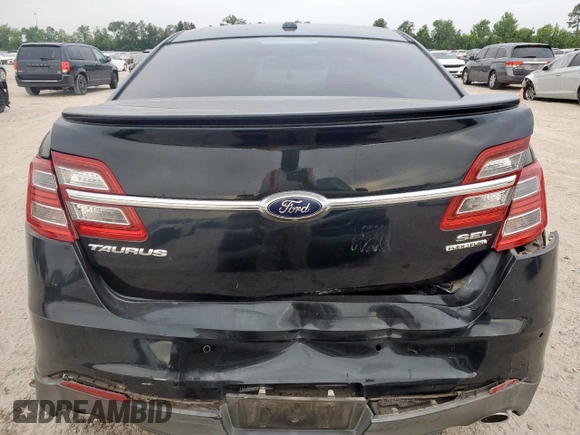 2014 Ford Taurus SEL z VIN 1FAHP2E84EG133955, wystawiony jako Copart lot #56630155 z przebiegiem 113 045 mil mil oraz Szkoda całkowita • Salvage title. Historia ofert i sprzedaży dostępna na DreamBid. Obrazek 6.