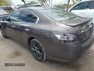 2014 Nissan Maxima S with VIN 1N4AA5AP0EC431251, listed as a IAAI auction lot 42120884 with 163,628 mi miles and . Bid and sale history available at DreamBid. Image 3.