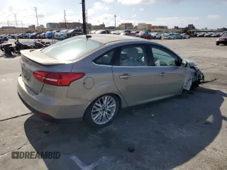 2015 Ford Focus Titanium с VIN 1FADP3J28FL288037, выставлен на аукционе Copart как лот 56972865 с пробегом 75 703 миль миль и Списание • Salvage title. История ставок и продаж доступна на DreamBid. Изображение 3.