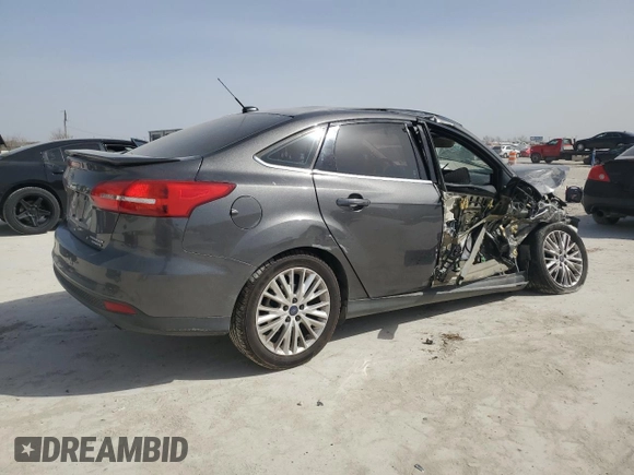 2016 Ford Focus Titanium with VIN 1FADP3J20GL274263, listed as a Copart auction lot 48340175 with 114,941 mi miles and Salvage title. Bid and sale history available at DreamBid. Image 3.