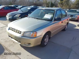 2000 Hyundai Accent z VIN KMHCG45G3YU034438, wystawiony jako IAAI lot #41356583 z przebiegiem 57 283 mil mil oraz . Historia ofert i sprzedaży dostępna na DreamBid. Obrazek 2.