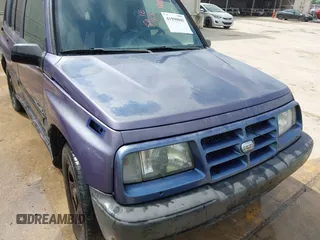 1996 Geo Tracker z VIN 2CNBE1361T6901708, wystawiony jako IAAI lot #41998005 z przebiegiem 223 266 mil mil oraz . Historia ofert i sprzedaży dostępna na DreamBid. Obrazek 6.