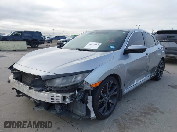 2019 Honda Civic Sport with VIN 19XFC2F8XKE015898, listed as a IAAI auction lot 41431062 with 108,071 mi miles and . Bid and sale history available at DreamBid. Image 2.