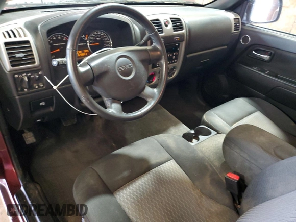 2009 GMC Canyon Work Truck with VIN 1GTCS149098128985, listed as a Copart auction lot 60897045 with 123,843 mi miles and Salvage title. Bid and sale history available at DreamBid. Image 8.