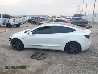 2019 Tesla Model 3 Mid Range with VIN 5YJ3E1EA8KF472540, listed as a IAAI auction lot 41661312 with 75,575 mi miles and . Bid and sale history available at DreamBid. Image 15.