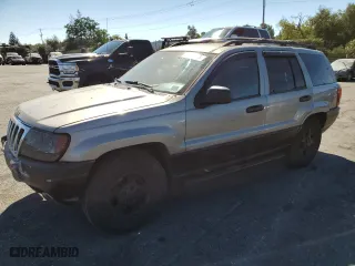 1999 Jeep Grand Cherokee Laredo with VIN 1J4GW58N4XC739465, listed as a Copart auction lot 76130544 with 195,649 mi miles and Salvage Title. Bid and sale history available at carsss.com. Image 1.