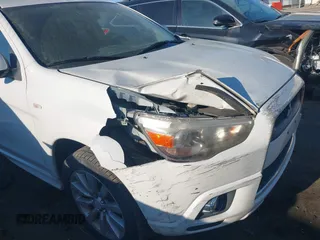 2011 Mitsubishi Outlander Sport SE with VIN JA4AR4AUXBZ023118, listed as a IAAI auction lot 41853985 with 139,529 mi miles. Bid and sale history available at carsss.com. Image 6.