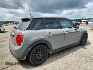 2015 MINI Hardtop 4 Door with VIN WMWXS5C5XFT831555, listed as a Copart auction lot 61673485 with 104,120 mi miles and Salvage title. Bid and sale history available at DreamBid. Image 3.