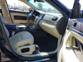 2013 Lincoln MKS z VIN 1LNHL9EK3DG617815, wystawiony jako IAAI lot #42239784 z przebiegiem 122 589 mil mil oraz . Historia ofert i sprzedaży dostępna na DreamBid. Obrazek 5.