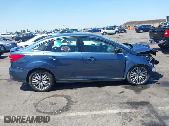 2018 Ford Focus Titanium with VIN 1FADP3J21JL323767, listed as a IAAI auction lot 42375218 with 104,440 mi miles and . Bid and sale history available at DreamBid. Image 13.