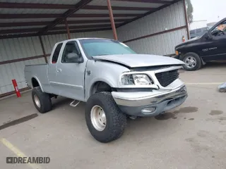 2000 Ford F-150 XL with VIN 1FTRX18L9YKA05396, listed as a IAAI auction lot 41637310 with 234,555 mi miles. Bid and sale history available at carsss.com. Image 1.