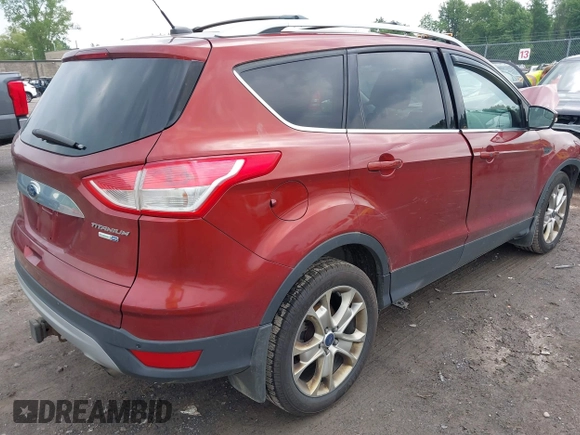 2015 Ford Escape Titanium z VIN 1FMCU9J98FUC84963, wystawiony jako IAAI lot #42469112 z przebiegiem 128 838 mil mil oraz . Historia ofert i sprzedaży dostępna na DreamBid. Obrazek 4.
