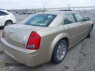 2006 Chrysler 300 Touring with VIN 2C3KA53G56H309497, listed as a IAAI auction lot 41792324 with 128,492 mi miles. Bid and sale history available at carsss.com. Image 4.