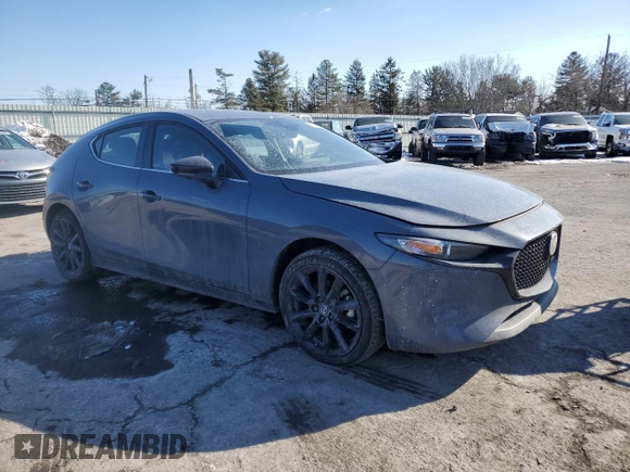 2023 Mazda 3 S Carbon Edition with VIN JM1BPBLM3P1616343, listed as a Copart auction lot 42303815 with 19,557 mi miles and Salvage title. Bid and sale history available at DreamBid. Image 4.
