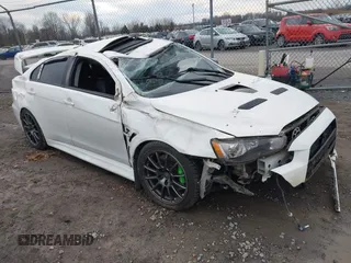 2014 Mitsubishi Lancer Evolution GSR with VIN JA32W8FV5EU012572, listed as a IAAI auction lot 40871463 with 89,529 mi miles. Bid and sale history available at carsss.com. Image 1.