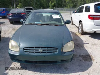 1999 Hyundai Sonata GLS with VIN KMHWF35V6XA107973, listed as a IAAI auction lot 42119318 with 174,231 mi miles. Bid and sale history available at carsss.com. Image 6.