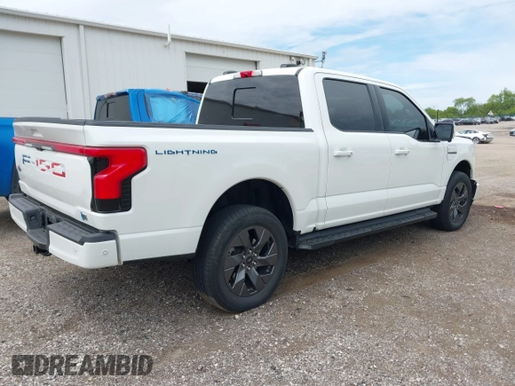 2022 Ford F-150 Lightning Pro with VIN 1FTVW1EL3NWG16132, listed as a IAAI auction lot 42362459 with 16,509 mi miles and . Bid and sale history available at DreamBid. Image 4.