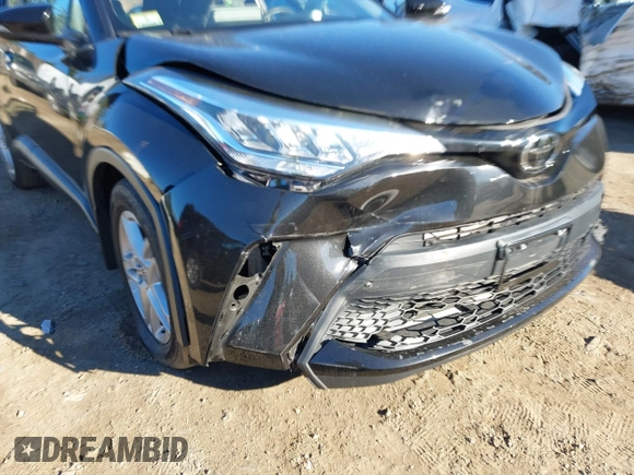 2021 Toyota C-HR LE with VIN NMTKHMBXXMR123633, listed as a IAAI auction lot 40787336 with 28,234 mi miles. Bid and sale history available at carsss.com. Image 6.
