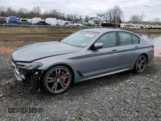 2023 BMW 5 Series M550i xDrive with VIN WBA13BK06PCN02733, listed as a Copart auction lot 48767235 with 27,725 mi miles and Salvage title. Bid and sale history available at DreamBid. Image 1.