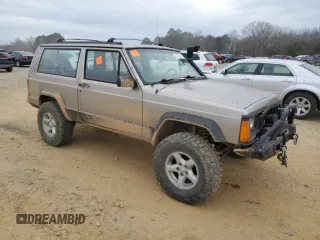 1993 Jeep Cherokee Sport with VIN 1J4FJ67S6PL580133, listed as a Copart auction lot 43230005 with 122,173 mi miles and Salvage Title. Bid and sale history available at carsss.com. Image 4.