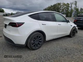 2023 Tesla Model Y Long Range z VIN 7SAYGDEE3PF751019, wystawiony jako Copart lot #57972885 z przebiegiem 24 591 mil mil oraz Szkoda całkowita • Salvage title. Historia ofert i sprzedaży dostępna na DreamBid. Obrazek 3.