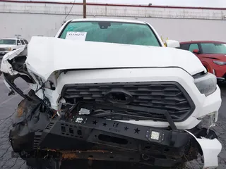 2021 Toyota Tacoma SR5 with VIN 3TMDZ5BN1MM100575, listed as a IAAI auction lot 41516274 with 61,974 mi miles and . Bid and sale history available at DreamBid. Image 13.