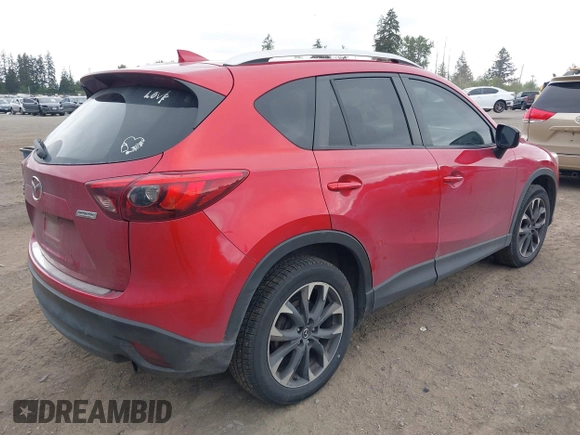 2016 Mazda CX-5 Grand Touring z VIN JM3KE4DY7G0687318, wystawiony jako IAAI lot #42228585 z przebiegiem 188 793 mil mil oraz . Historia ofert i sprzedaży dostępna na DreamBid. Obrazek 4.