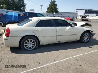 2009 Chrysler 300 Touring with VIN 2C3LA53V69H553621, listed as a Copart auction lot 70569634 with 141,157 mi miles and Salvage Title. Bid and sale history available at carsss.com. Image 3.
