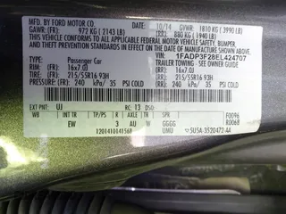 2014 Ford Focus SE with VIN 1FADP3F28EL424707, listed as a IAAI auction lot 42002883 with 115,746 mi miles. Bid and sale history available at carsss.com. Image 9.
