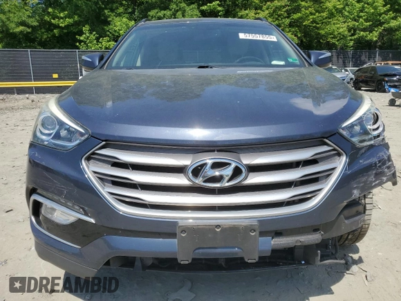 2017 Hyundai Santa Fe 2.4L z VIN 5NMZUDLB7HH028678, wystawiony jako Copart lot #57557855 z przebiegiem 102 049 mil mil oraz Szkoda całkowita • Salvage title. Historia ofert i sprzedaży dostępna na DreamBid. Obrazek 5.